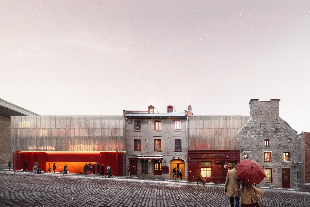 Glass facade with red lower band sits in a historic district.