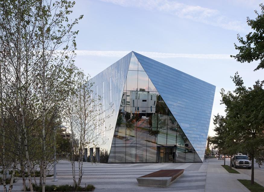 Angular glass building with sloped sides