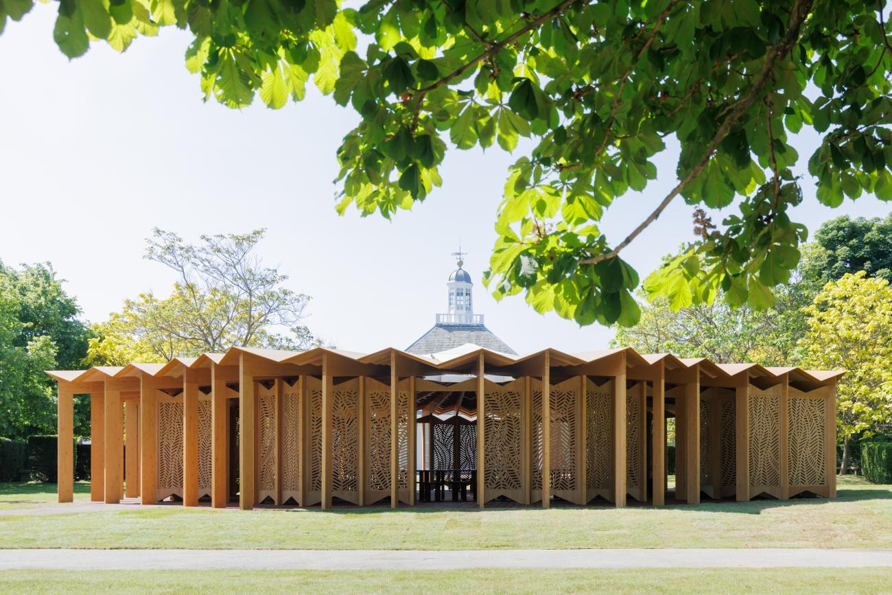 Round wooden pavilion with decorative wooden screens