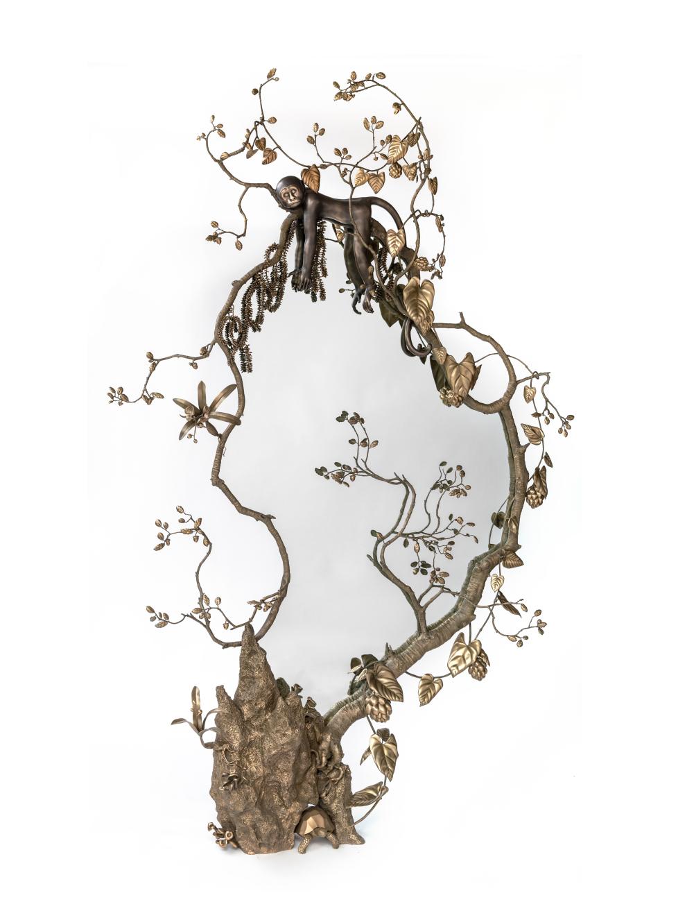 Mirror surrounded with bronze foliage