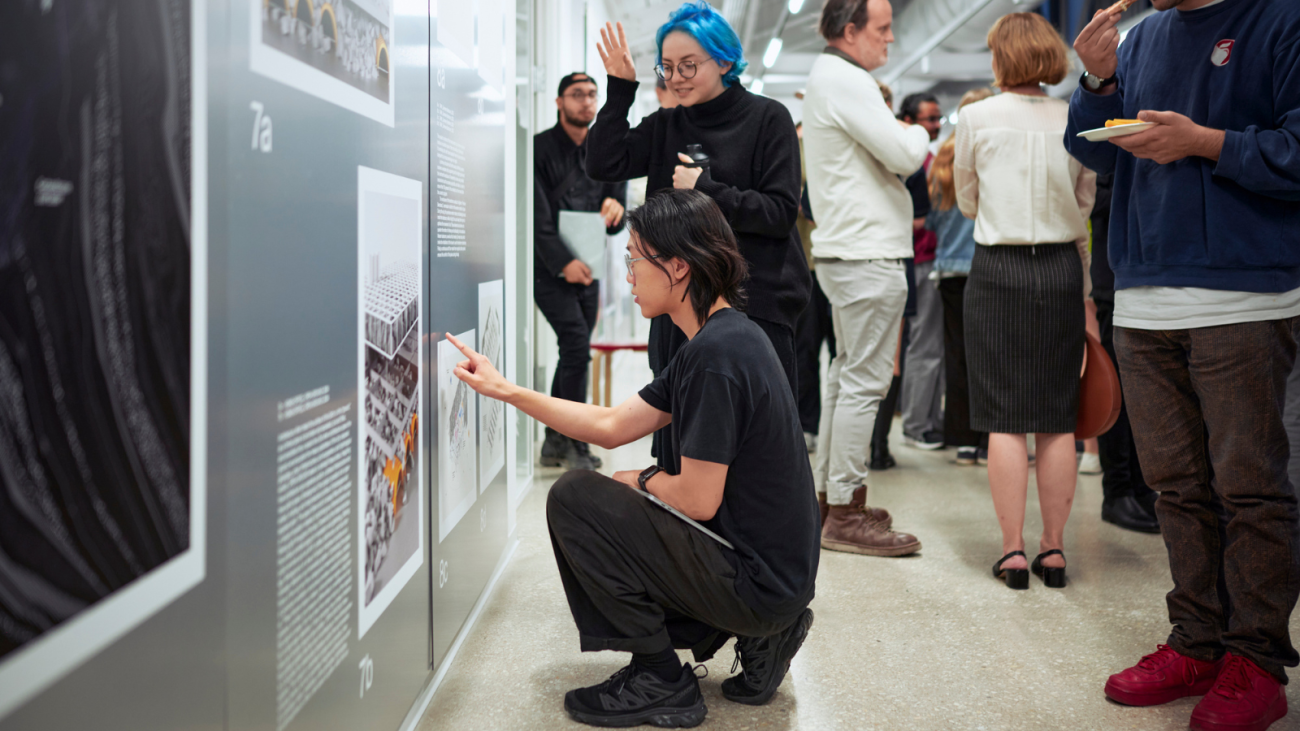 Students discuss an exhibit at "The Sixth Sphere"