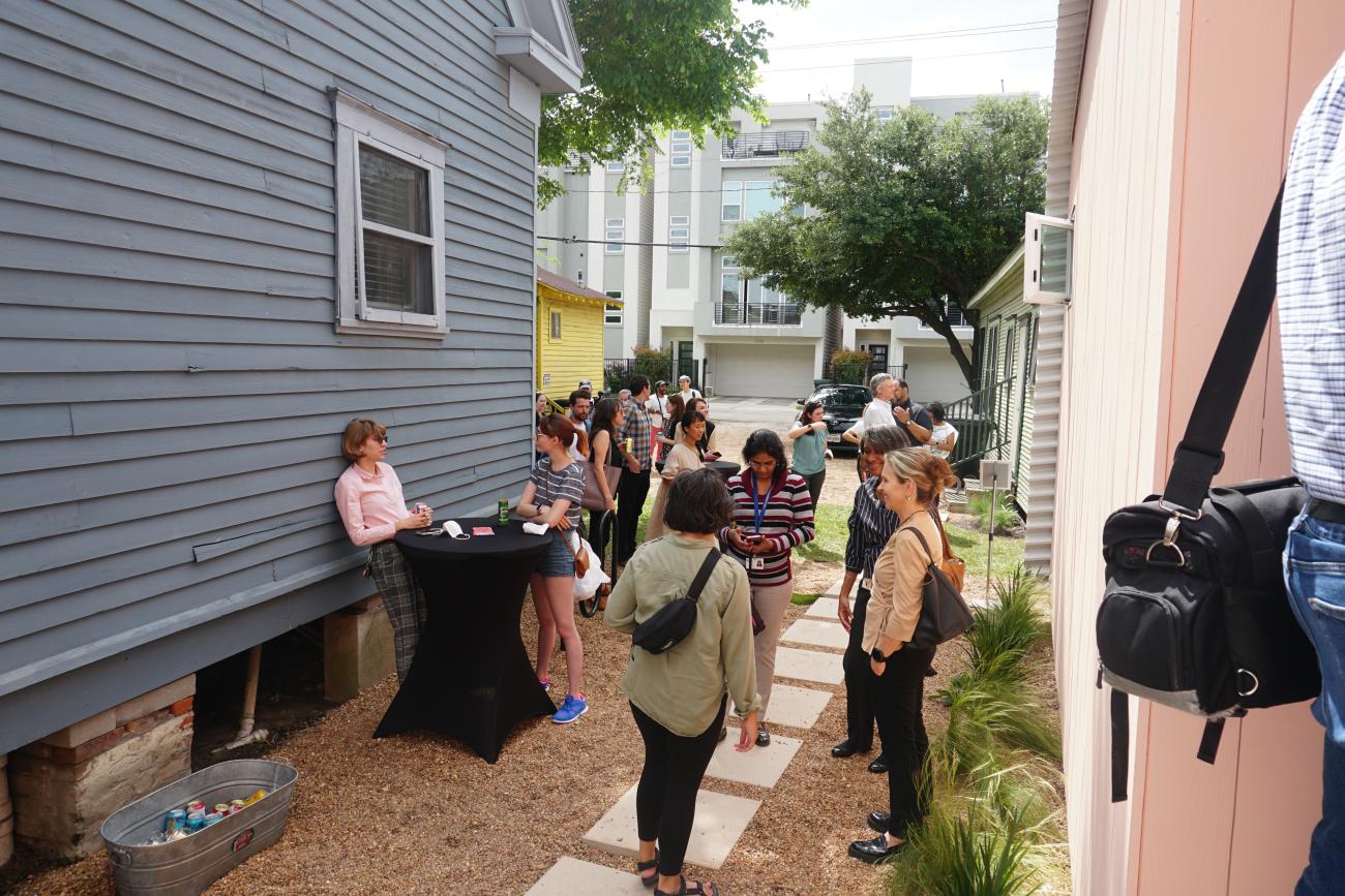 photo of people standing near accessory dwelling unit