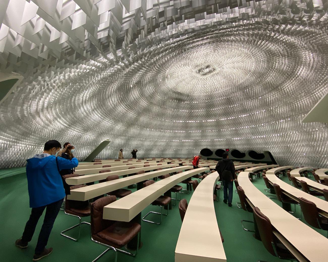 Student in interior of domed building