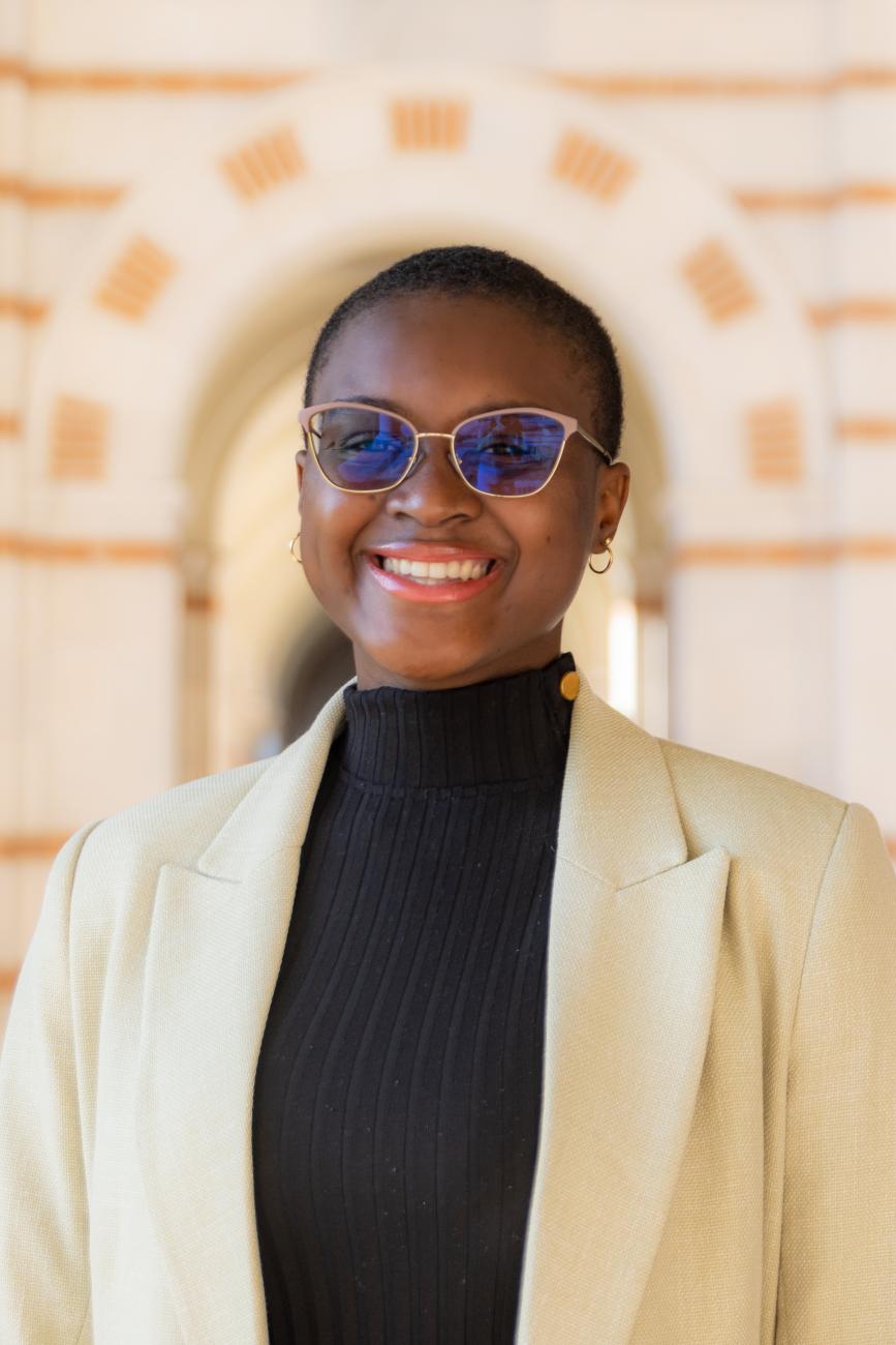 Photo of black woman with short hair and glasses